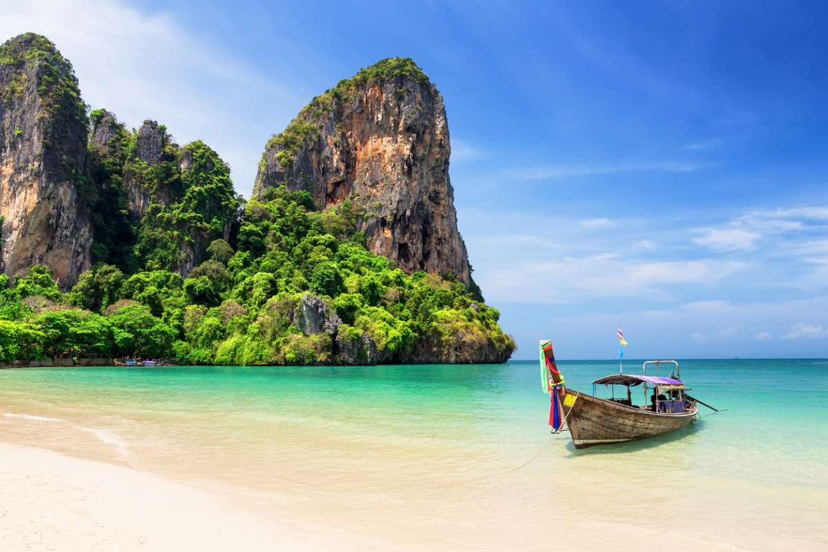 Thai-traditional-wooden-longtail-boat-and-the-beautiful-sandy-beach-W1200
